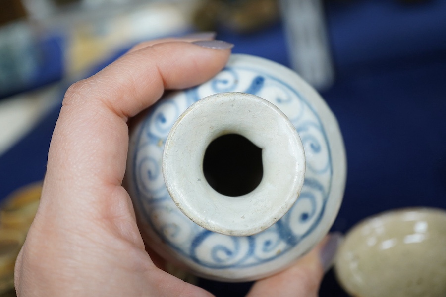 A group of Thai or Annamese miniature pottery vessels and a small blue and white vase, vase 9.5cm high. Condition - poor, fair and good